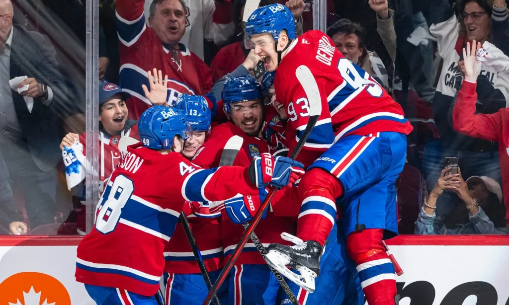Hockey players celebrating a goal.
