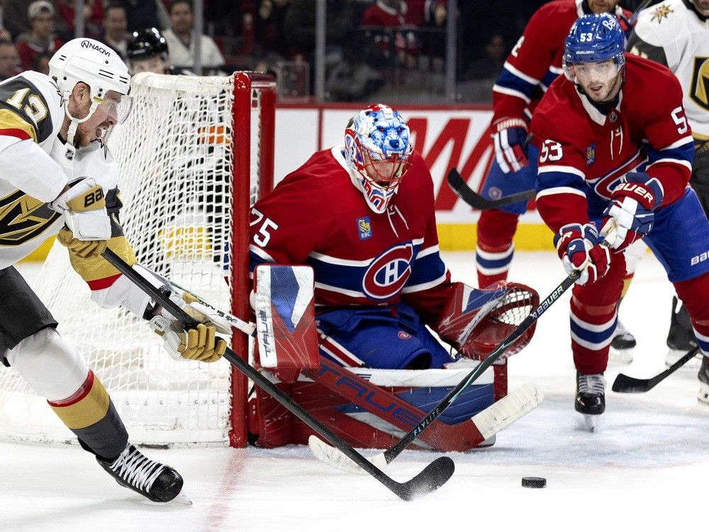 Vegas Golden Knights right wing Reilly Smith (19) attempts a wrap around on Canadiens goaltender Jakub Dobes (75) as Canadiens defenceman Noah Dobson (53) covers the crease during second period NHL action in Montreal, on Tuesday, Jan. 27, 2026.
