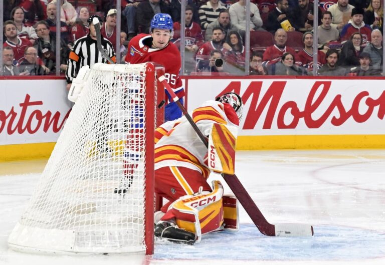Flames stunned by speedy Habs in road trip opener
