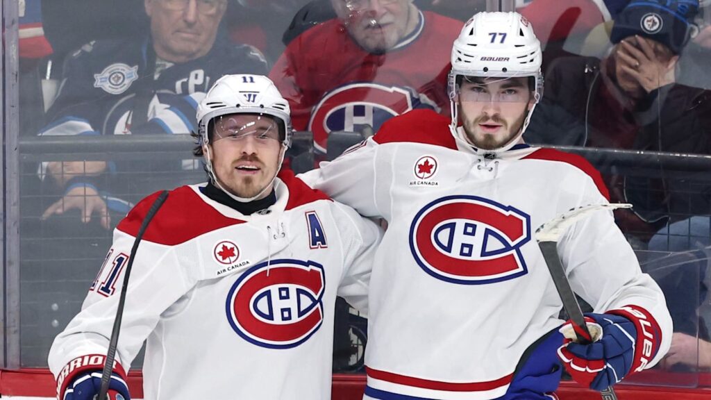 Feb 4, 2026; Winnipeg, Manitoba, CAN; Montreal Canadiens right wing Brendan Gallagher (11) celebrates a goal against the Winnipeg Jets with center Kirby Dach (77) in the third period at Canada Life Centre. Mandatory Credit: James Carey Lauder-Imagn Images