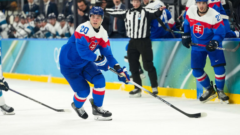 Feb 21, 2026; Milan, Italy; Juraj Slafkovsky (20) of Slovakia moves the puck in the second period against Finland in the men's ice hockey bronze medal game during the Milano Cortina 2026 Olympic Winter Games at Milano Santagiulia Ice Hockey Arena. Mandatory Credit: Joe Camporeale-Imagn Images