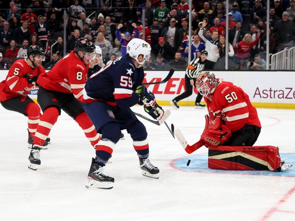 Team Canada's Jordan Binnington makes a save on Jake Guentzel of the U.S. during third period of 4 Nations Face-Off final in Boston on Feb. 20, 2025.