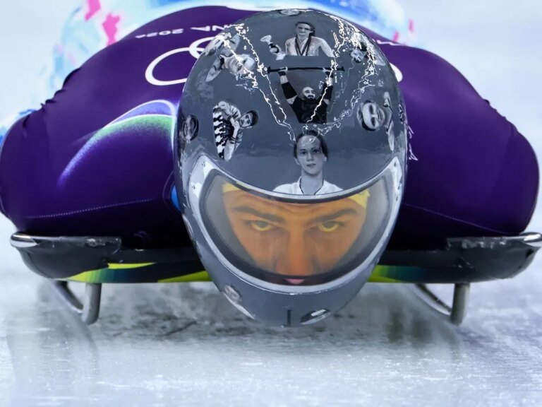 Ukraine's Vladyslav Heraskevych wears a helmet with images of Ukrainian athletes and coaches killed since Russia invaded their country in 2022 during his skeleton training session at the Milano Cortina Winter Olympics in Cortina d'Ampezzo on Feb. 9.