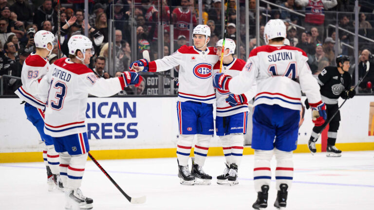 Mar 7, 2026; Los Angeles, California, USA; Montréal Canadiens left wing Juraj Slafkovský (20) is greeted by teammates after scoring during the third period against the Los Angeles Kings at Crypto.com Arena. Mandatory Credit: William Liang-Imagn Images