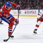 Feb 25, 2025; Montreal, Quebec, CAN; Montreal Canadiens right wing Patrik Laine (92) shoots the puck against the Carolina Hurricanes in the third period at Bell Centre. Mandatory Credit: David Kirouac-Imagn Images