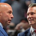 Jul 7, 2022; Montreal, Quebec, CANADA; Montreal Canadiens general manager Kent Hughes (left) talks with head coach Martin St. Louis before the first round of the 2022 NHL Draft at Bell Centre. Mandatory Credit: Eric Bolte-Imagn Images