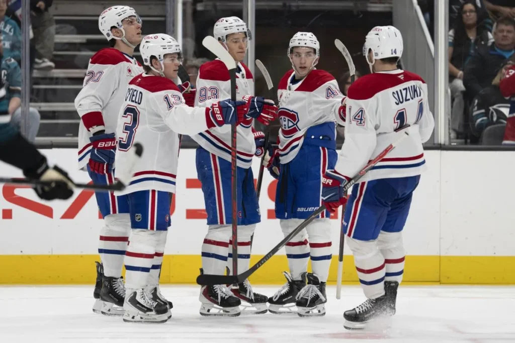 Montreal Canadiens right wing Cole Caufield (13) , left wing Juraj Slafkovsk&yacute; (20) , right wing Ivan Demidov (93) defenseman Lane Hutson (48) and center Nick Suzuki (14) celebrate after scoring a goal during the third period against the San Jose Sharks at SAP Center at San Jose.