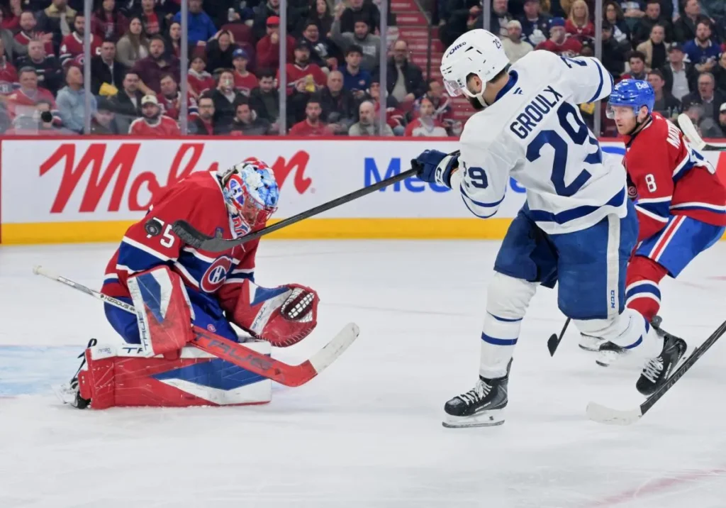 Toronto Maple Leafs forward Bo Groulx (29) shoots the puck against Montreal Canadiens goalie Jakub Dobes (75) during the third period at the Bell Centre.