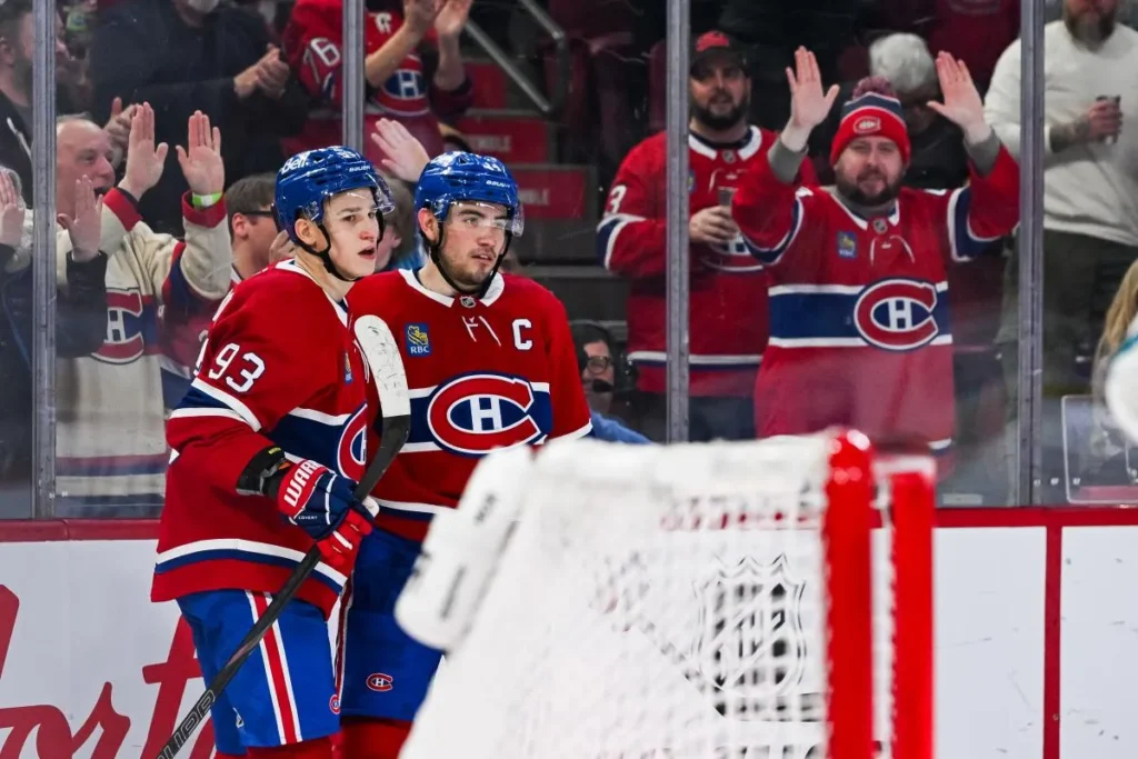 Montreal Canadiens center Nick Suzuki (14) celebrates with right wing Ivan Demidov (93) his goal against the San Jose Sharks during the second period at Bell Centre.