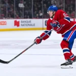 Montreal Canadiens defenseman David Reinbacher (64) shoots the puck Toronto Maple Leafs during the third period at Bell Centre.