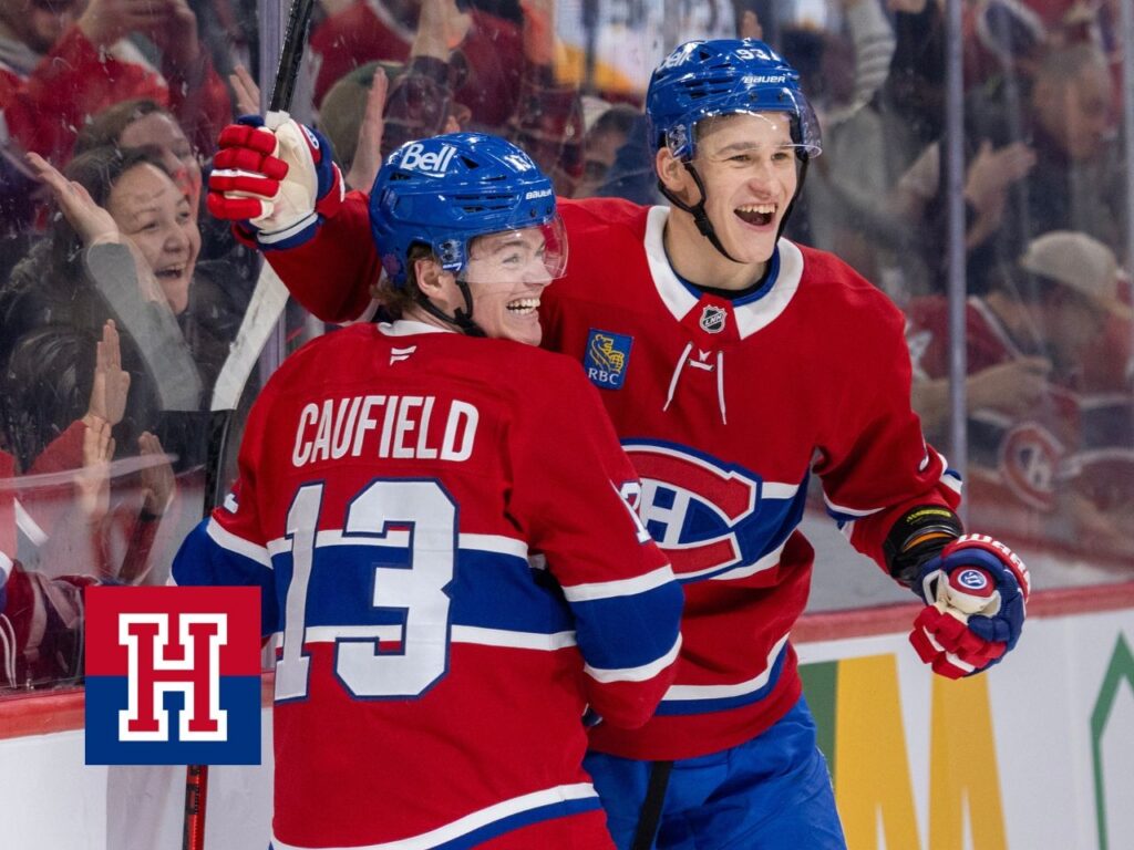Canadiens' Cole Caufield and Ivan Demidov celebrate Caufield's goal against the New York Islanders in Montreal on Feb. 26.