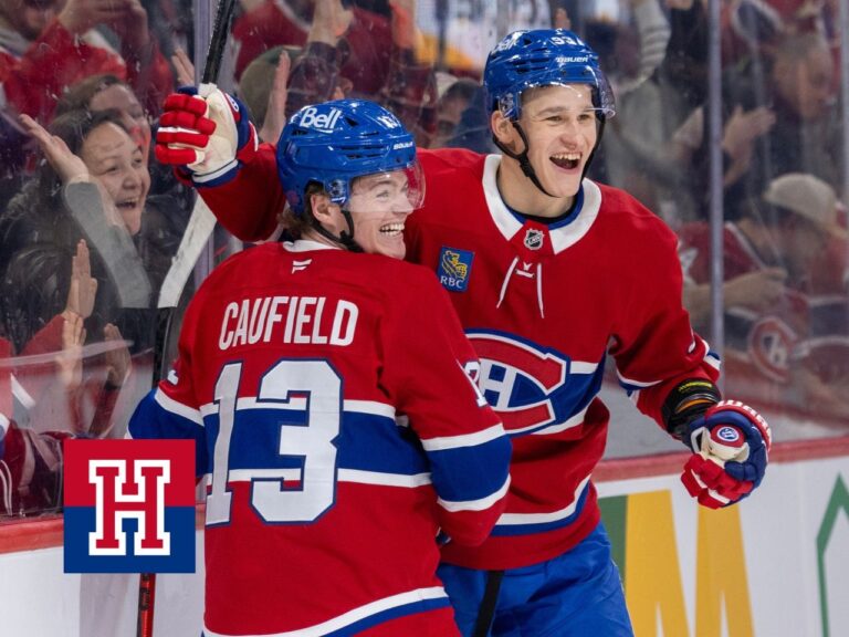 Canadiens' Cole Caufield and Ivan Demidov celebrate Caufield's goal against the New York Islanders in Montreal on Feb. 26.