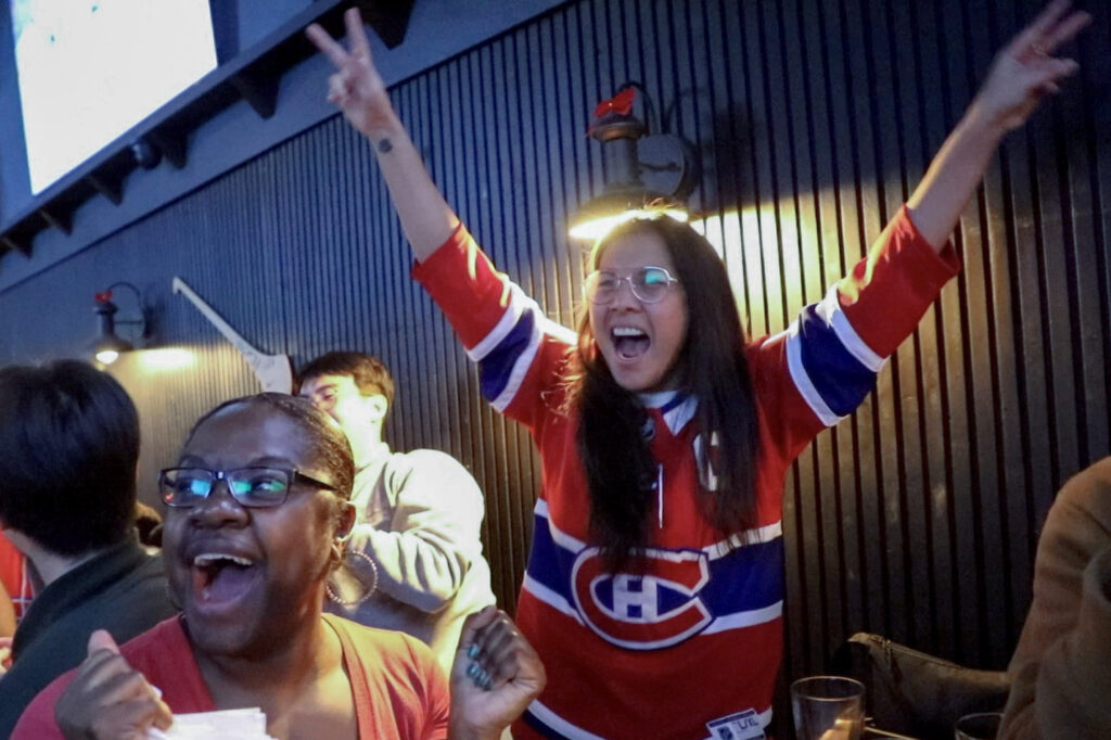 Fans celebrate in Montreal on Sunday night after the Canadiens won in overtime against the Tampa Bay Lightning in Game 1 of their playoff series.