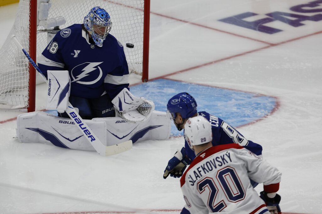 Montreal Canadiens left wing Juraj Slafkovsky scores on Tampa Bay Lightning goaltender Andrei Vasilevskiy.