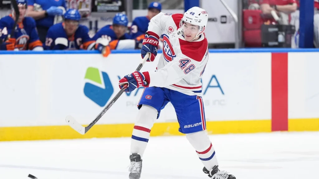 Montreal Canadiens defenseman Lane Hutson (48) shoots during the third period against the New York Islanders at UBS Arena.