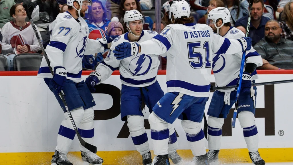Tampa Bay Lightning center Brayden Point (21) celebrates his goal with defenseman Victor Hedman (77) and defenseman Charle-Edouard D