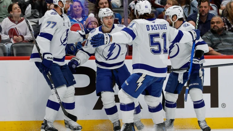 Tampa Bay Lightning center Brayden Point (21) celebrates his goal with defenseman Victor Hedman (77) and defenseman Charle-Edouard D