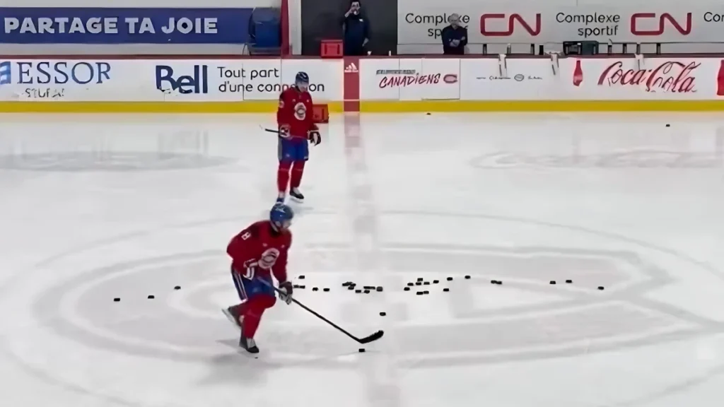 Photo of Mike Matheson and Noah Dobson at Canadiens practice in Brossard