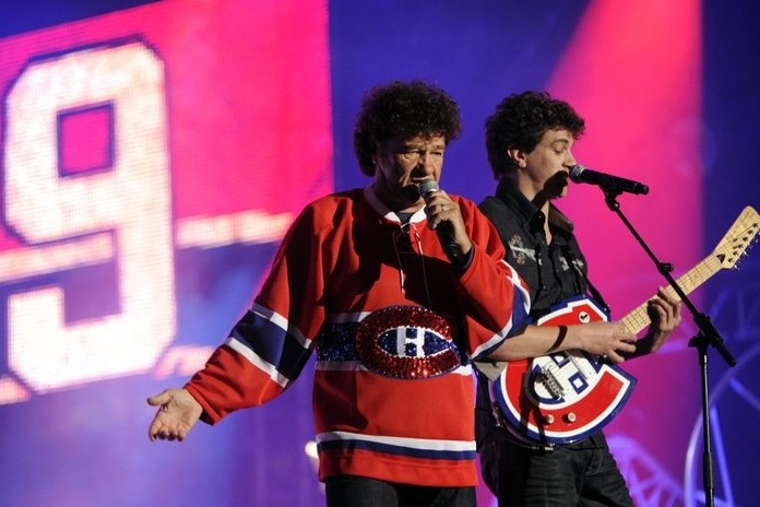 Quebec singer Robert Charlebois wearing a Canadiens jersey and his son Jérôme Charlebois perform at the Fête Nationale concert at Parc Maisonneuve in Montreal on June 24, 2012.
