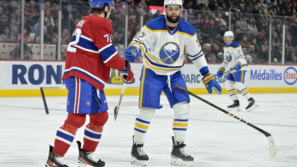 Buffalo Sabres forward Jordan Greenway (12) breaks his stick checking Montreal Canadiens defenseman Arber Xhekaj (72) during the first period at the Bell Centre.