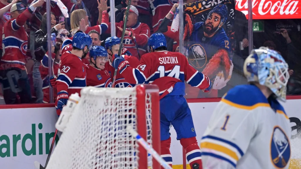 Montreal Canadiens forward Cole Caufield (13) celebrates with teammates forward Juraj Slafkovsky (20) and forward Ivan Demidov (93) and forward Nick Suzuki (14) after scoring a goal against Buffalo Sabres goalie Ukko-Pekka Luukkonen (1) during the first period in game four of the second round of the 2026 Stanley Cup Playoffs at Bell Centre.
