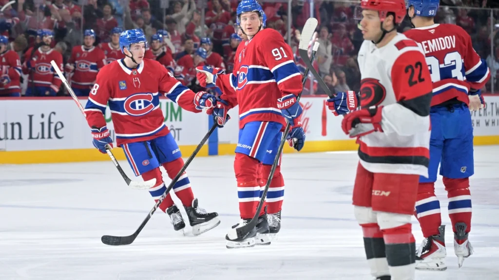 Montreal Canadiens forward Oliver Kapanen (91) celebrates with teammates after scoring a goal against the Carolina Hurricanes during the first period at the Bell Centre.