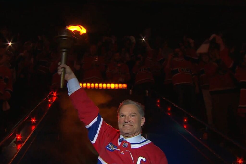 Former Capitals assistant coach Kirk Muller carries ceremonial torch before Canadiens playoff game