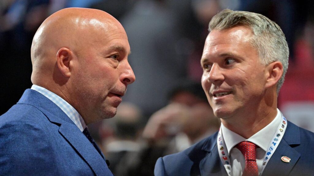 Jul 7, 2022; Montreal, Quebec, CANADA; Montreal Canadiens general manager Kent Hughes (left) talks with head coach Martin St. Louis before the first round of the 2022 NHL Draft at Bell Centre. Mandatory Credit: Eric Bolte-Imagn Images