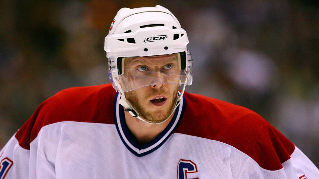 Jan 27, 2007; Toronto, ON, Canada; Montreal Canadiens center (11) Saku Koivu looks on against the Toronto Maple Leafs center (21) John Pohl at the Air Canada Centre in Toronto, ON. Mandatory Credit: Tom Szczerbowski-Imagn Images