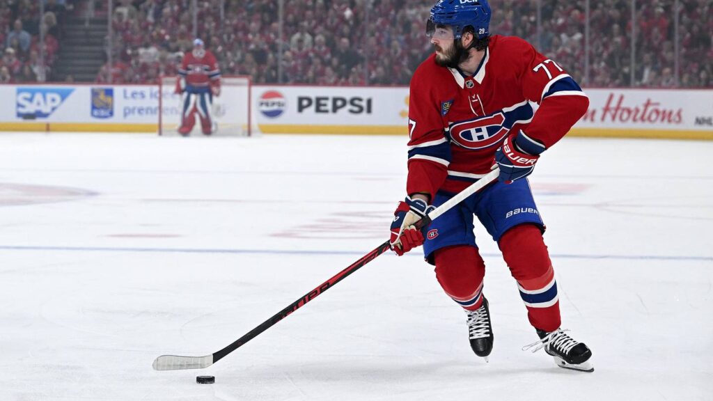 May 27, 2026; Montreal, Quebec, CAN; Montreal Canadiens center Kirby Dach (77) skates with the puck against the Carolina Hurricanes during the first period in game four of the Eastern Conference Final of the 2026 Stanley Cup Playoffs at Bell Centre. Mandatory Credit: David Kirouac-Imagn Images