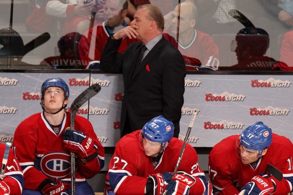 Canadiens head coach Michel Therrien ponders his next move as Brendan Gallagher looks up at the scoreboard next to Alex Galchenyuk, centre, and Rene Bourque during final minutes of Game 5 against the Ottawa Senators in Montreal on May 9, 2013.