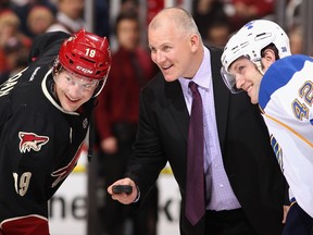 Former NHL player Keith Tkachuk prepares to drop the puck before a game between the St. Louis Blues and the Phoenix Coyotes in 2011.