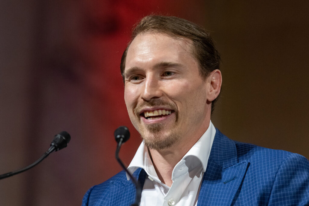 Brendan Gallagher speaks at a podium