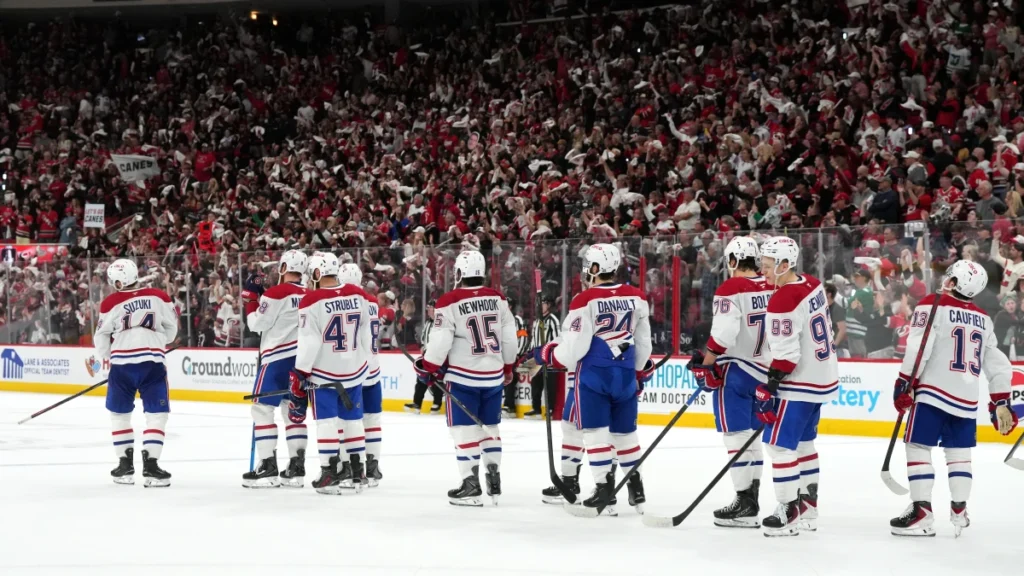 Montreal Canadiens players wait in the handshake line after losing to the Carolina Hurricanes in game five of the Eastern Conference Final of the 2026 Stanley Cup Playoffs at Lenovo Center.