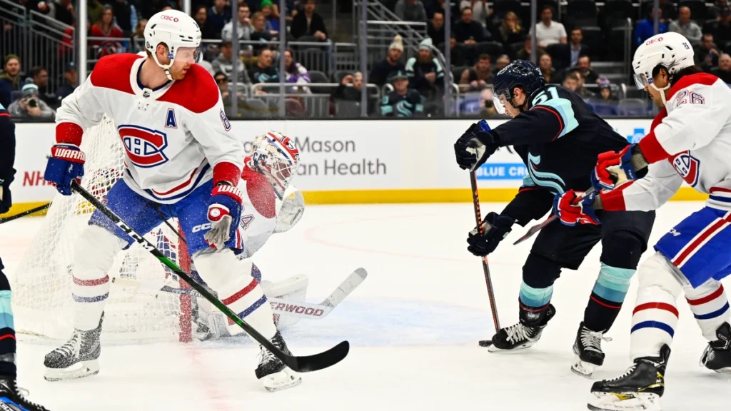 Seattle Kraken center Shane Wright (51) shoots against the Montreal Canadiens during the first period at Climate Pledge Arena.