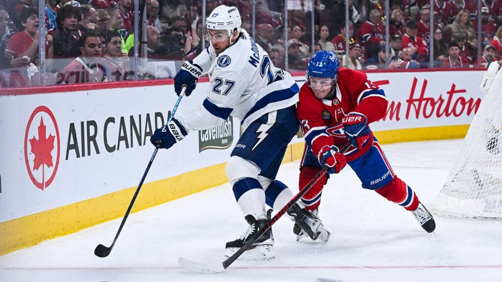 Apr 26, 2026; Montreal, Quebec, CAN; Tampa Bay Lightning defenseman Ryan McDonagh (27) defends the puck against Montreal Canadiens right wing Cole Caufield (13) during the third period in game four of the first round of the 2026 Stanley Cup Playoffs at Bell Centre. Mandatory Credit: David Kirouac-Imagn Images