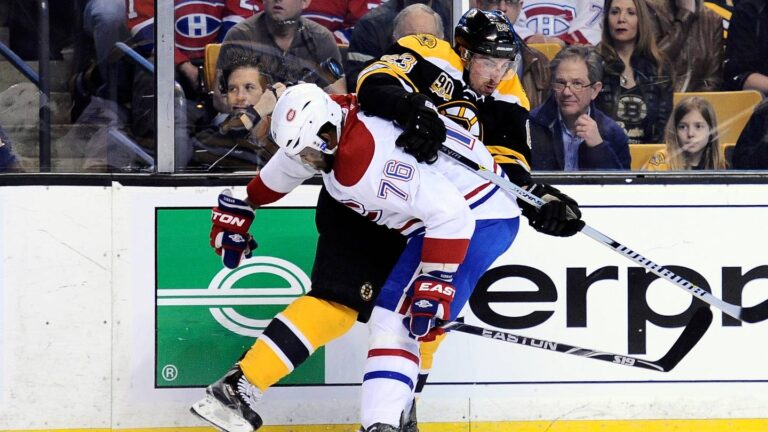 May 3, 2014; Boston, MA, USA; Montreal Canadiens defenseman P.K. Subban (76) checks Boston Bruins left wing Brad Marchand (63) along the boards during the first period in game two of the second round of the 2014 Stanley Cup Playoffs at TD Banknorth Garden. Mandatory Credit: Bob DeChiara-USA TODAY Sports