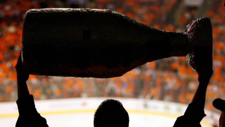 Apr 28, 2008; Philadelphia, PA, USA; A fan of the Philadelphia Flyers holds up a replica Stanley Cup during the Flyers 3-2 win over the Montreal Canadiens in game 3 of the NHL Eastern Conference semi-finals at Wachovia Center in Philadelphia, PA. Mandatory Credit: Geoff Burke-USA TODAY Sports