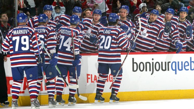 MONTREAL - FEBRUARY 01: Robert Lang #20 of the Montreal Canadiens celebrates his first period goal against the Boston Bruins at the players' bench at the Bell Centre on February 1, 2009 in Montreal, Quebec, Canada. (Photo by Andre Ringuette/NHLI via Getty Images)