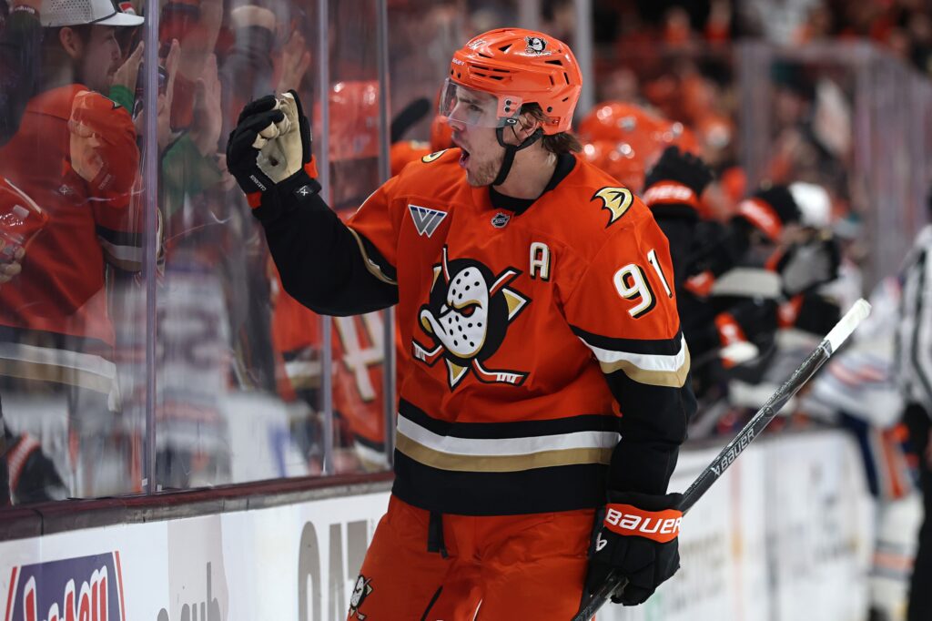 Ducks centre Leo Carlsson shouts in excitement as he waves right arm at the crowd.