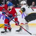Montreal Canadiens defenseman Lane Hutson (48) defends the puck against Las Vegas Golden Knights center William Karlsson (71) during the first period at Bell Centre.