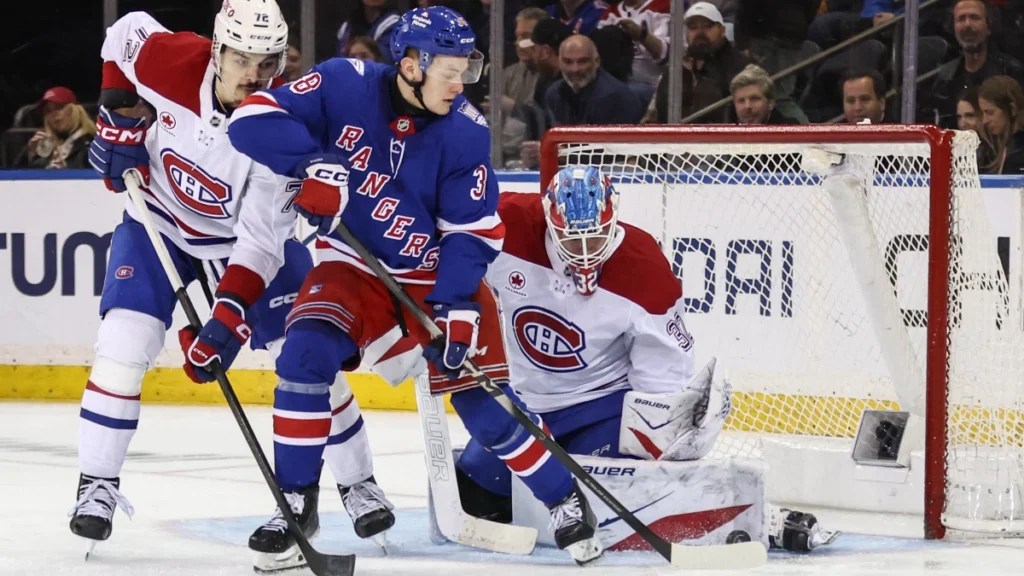 MontrŽal Canadiens goaltender Jacob Fowler (32) defends against a shot on goal by New York Rangers left wing Adam Sykora (38) in the third period at Madison Square Garden.