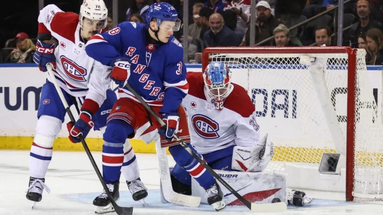 MontrŽal Canadiens goaltender Jacob Fowler (32) defends against a shot on goal by New York Rangers left wing Adam Sykora (38) in the third period at Madison Square Garden.