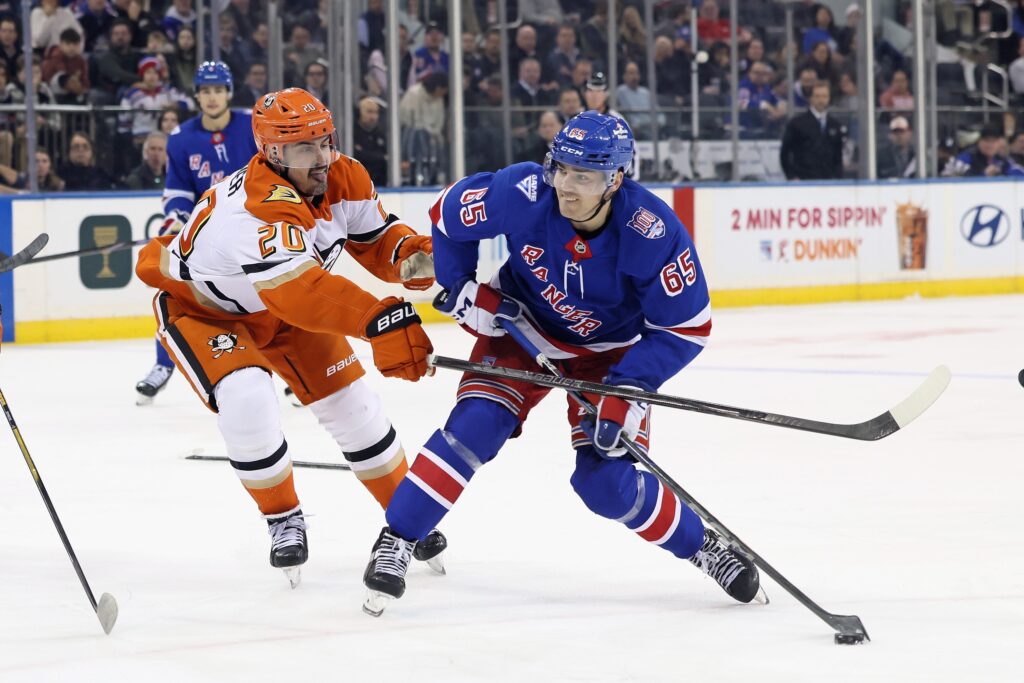 Chris Kreider #20 of the Anaheim Ducks checks Brett Berard #65 of the New York Rangers