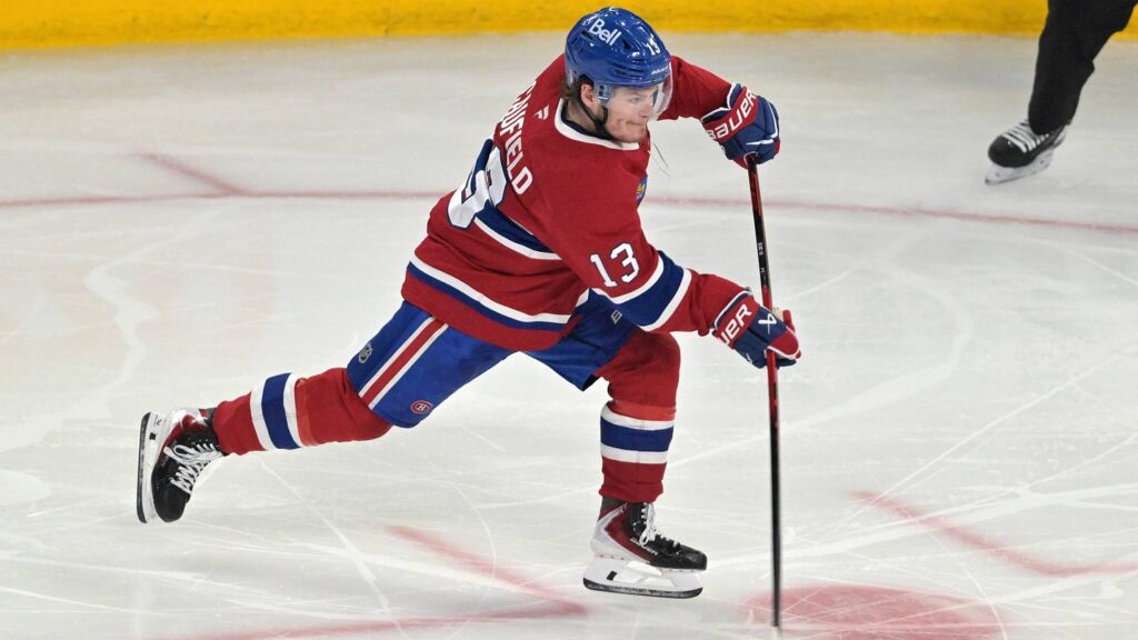 May 27, 2026; Montreal, Quebec, CAN; Montreal Canadiens right wing Cole Caufield (13) shoots the puck against the Carolina Hurricanes during the second period in game four of the Eastern Conference Final of the 2026 Stanley Cup Playoffs at Bell Centre. Mandatory Credit: Eric Bolte-Imagn Images