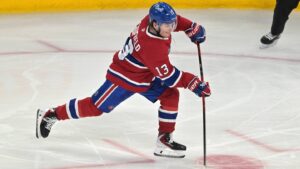 May 27, 2026; Montreal, Quebec, CAN; Montreal Canadiens right wing Cole Caufield (13) shoots the puck against the Carolina Hurricanes during the second period in game four of the Eastern Conference Final of the 2026 Stanley Cup Playoffs at Bell Centre. Mandatory Credit: Eric Bolte-Imagn Images