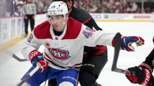 May 29, 2026; Raleigh, North Carolina, USA; Montreal Canadiens defenseman Lane Hutson (48) vies for the position against Carolina Hurricanes center Seth Jarvis (24) in game five of the Eastern Conference Final of the 2026 Stanley Cup Playoffs during the third period at Lenovo Center. Mandatory Credit: James Guillory-Imagn Images