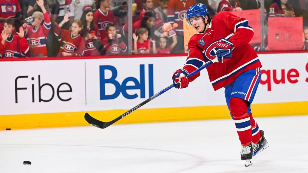 Sep 30, 2023; Montreal, Quebec, CAN; Montreal Canadiens defenseman David Reinbacher (64) shoots a puck during warm-up before the game against the Toronto Maple Leafs at Bell Centre. Mandatory Credit: David Kirouac-USA TODAY Sports