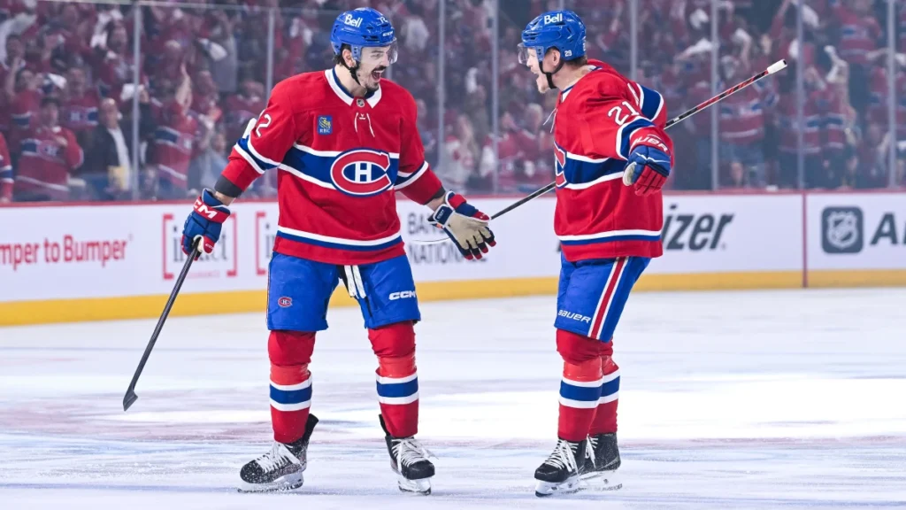 Montreal Canadiens defenseman Arber Xhekaj (72) celebrates with defenseman Kaiden Guhle (21) his goal against the Buffalo Sabres during the first period in game six of the second round of the 2026 Stanley Cup Playoffs at Bell Centre.