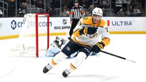 Apr 2, 2026; Los Angeles, California, USA; Nashville Predators right wing Luke Evangelista (77) celebrates after winning the penalty shootout against the Los Angeles Kings at Crypto.com Arena. Mandatory Credit: Griffin Hooper-Imagn Images